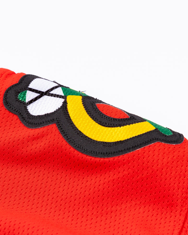 red Fanatics Chicago Blackhawks jersey with Lukas Reichel stitched name and number - alt shoulder detail lay flat