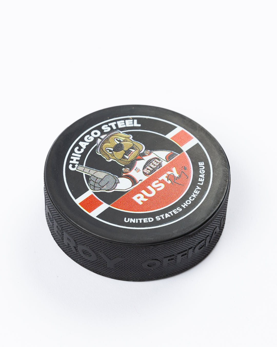 hockey puck with Chicago Steel mascot Rusty graphic on one side - angled lay flat