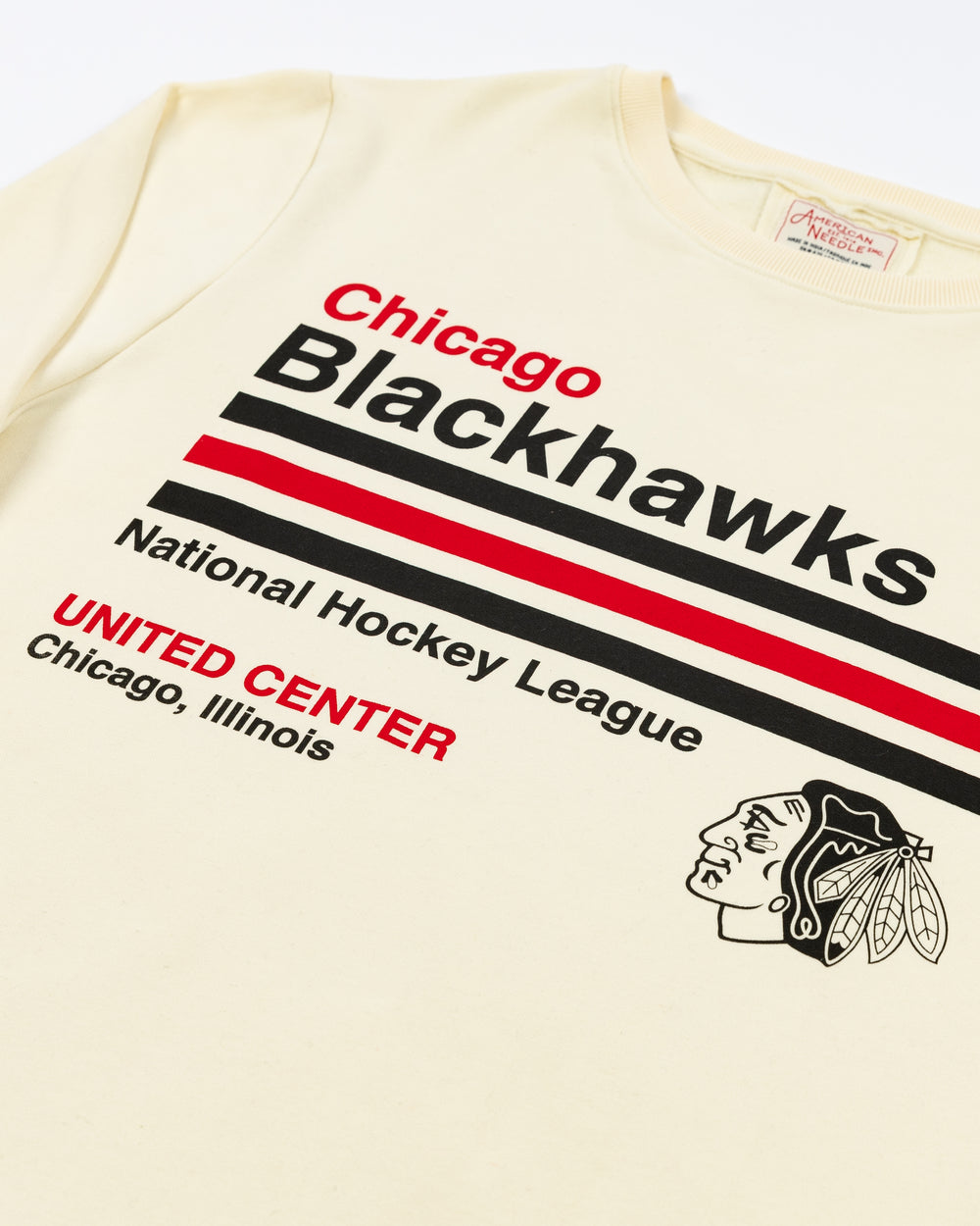 cream American Needle crewneck with retro-inspired Chicago Blackhawks graphic across front and NHL logo on left shoulder - front detail lay flat