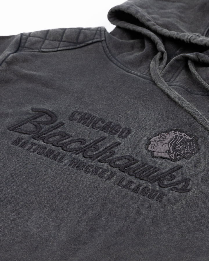 washed black American Needle hoodie with tonal vintage-inspired Chicago Blackhawks graphic on front - front detail lay flat