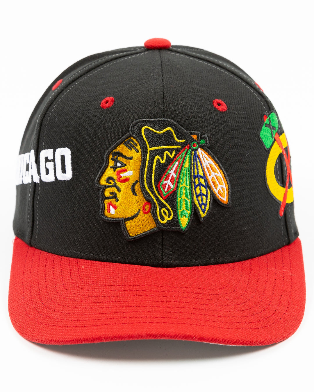 black and red Mitchell & Ness snapback with Chicago Blackhawks primary logo on front, secondary logo on left side and wordmark Chicago on right - front lay flat