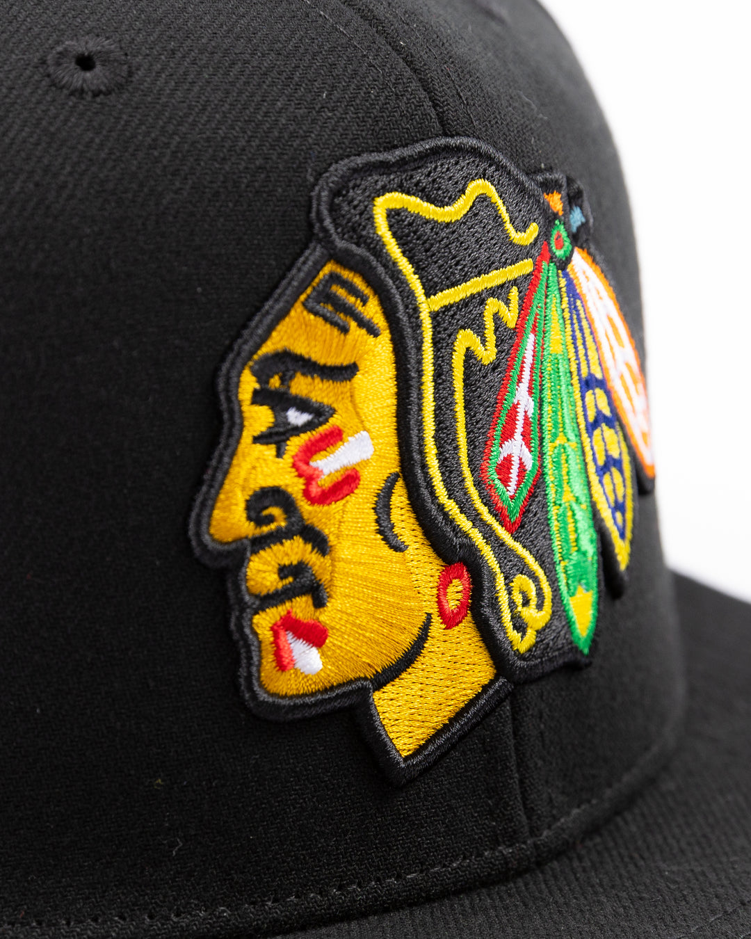 black Mitchell & Ness snapback cap with Chicago Blackhawks primary logo embroidered on front and 2015 Stanley Cup championship patch on right side - front detail lay flat