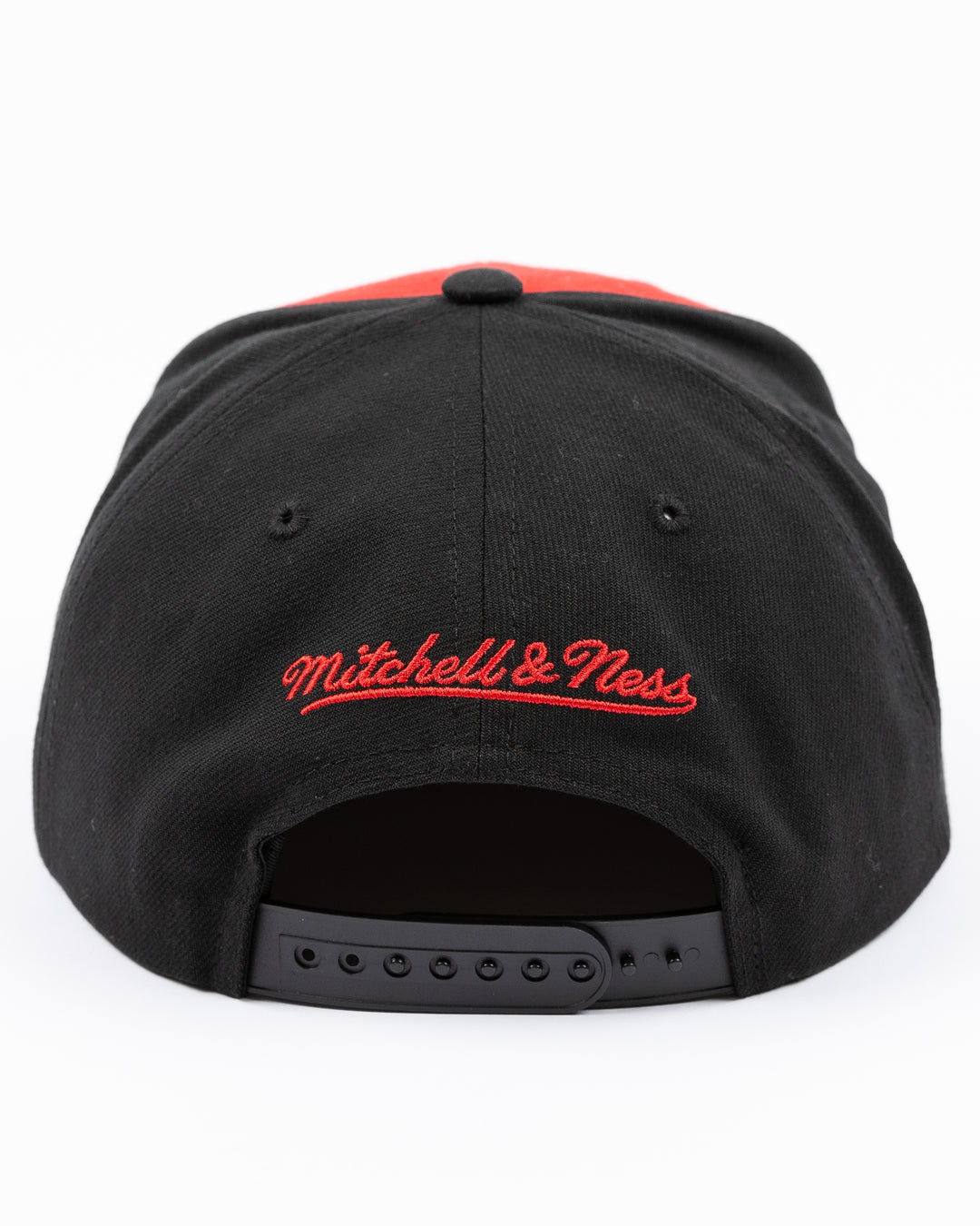 black white and red Mitchell & Ness snapback cap with Chicago Blackhawks wordmark on front and primary logo on right side - back lay flat