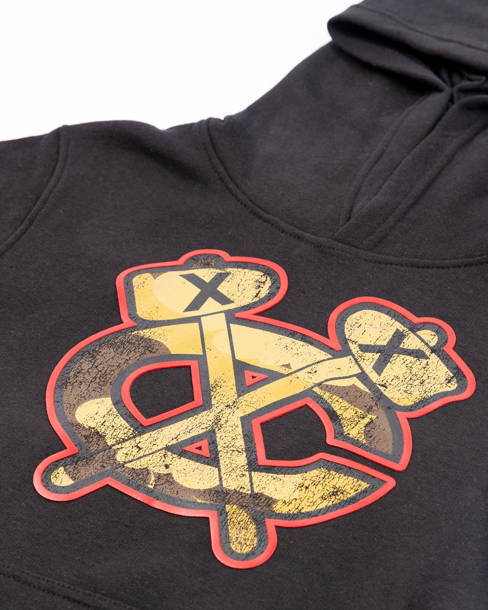 black youth sized hoodie with Chicago Blackhawks secondary mark in camo colorway on front - detail lay flat