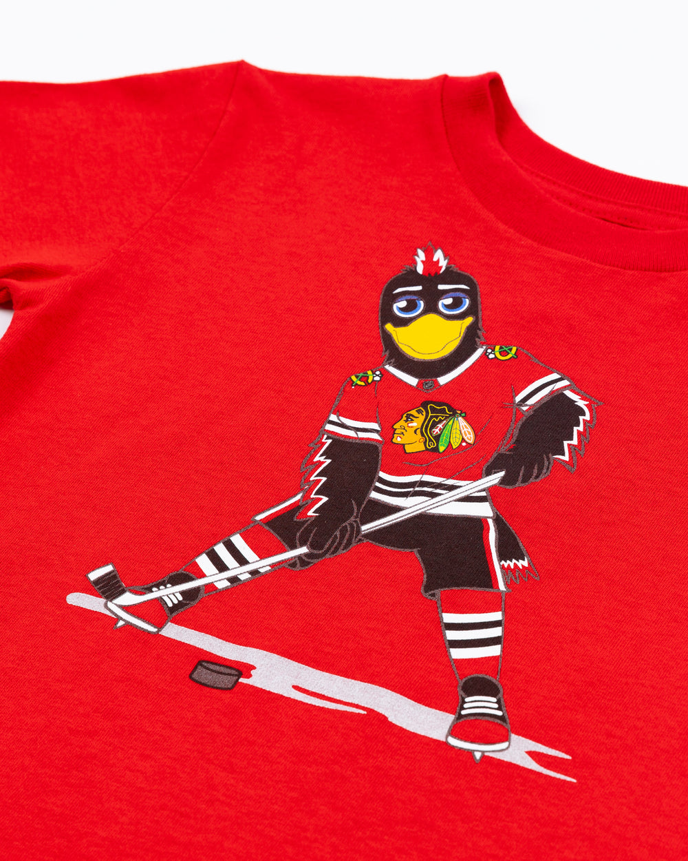 red Mitchell & Ness kids short sleeve tee with Chicago Blackhawks mascot Tommy Hawk on front - front detail lay flat