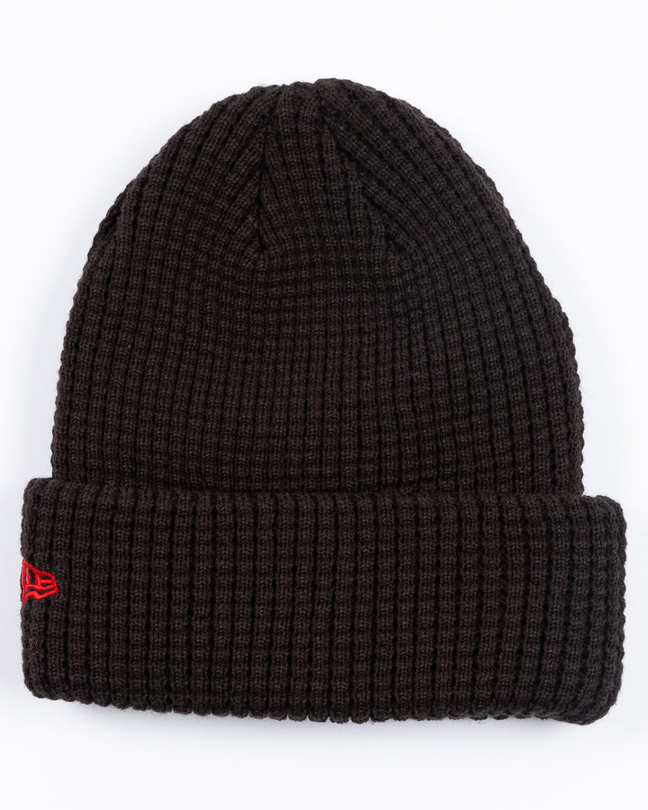 youth New Era black knit waffle beanie with embroidered Chicago Blackhawks primary logo on front cuff - back lay flat