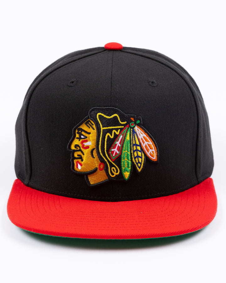 two tone red and black Mitchell &amp; Ness snapback with embroidered primary logo on front - front lay flat