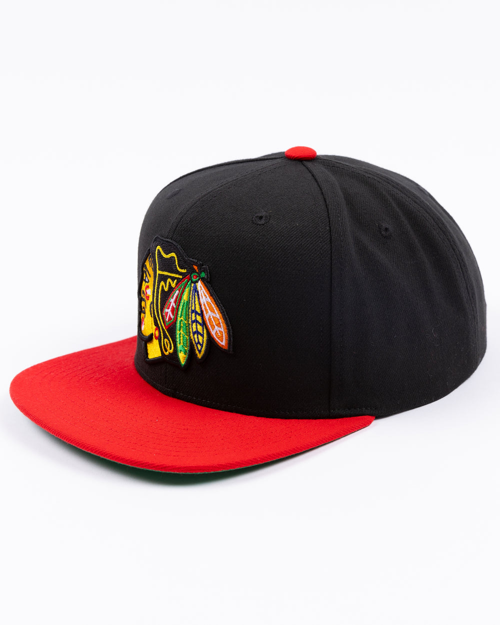 two tone red and black Mitchell & Ness snapback with embroidered primary logo on front - left angle lay flat