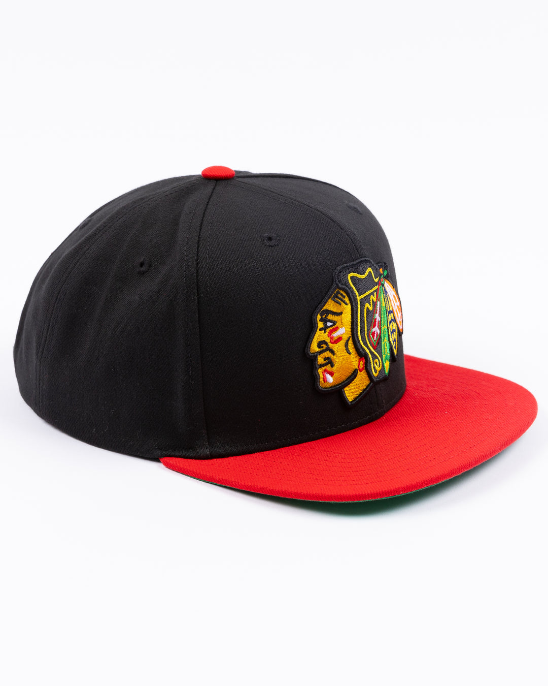 two tone red and black Mitchell &amp; Ness snapback with embroidered primary logo on front - right angle lay flat