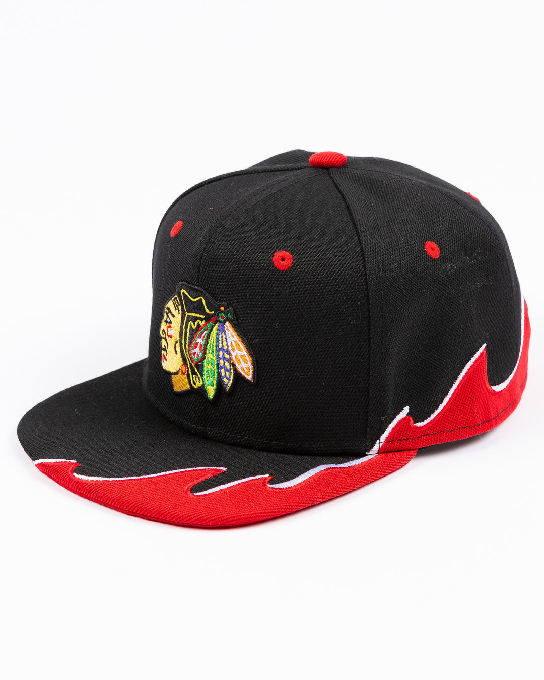 youth black MItchell & Ness snapback cap with Chicago Blackhawks primary logo on front and tide design embroidered on brim and left side - left angle lay flat