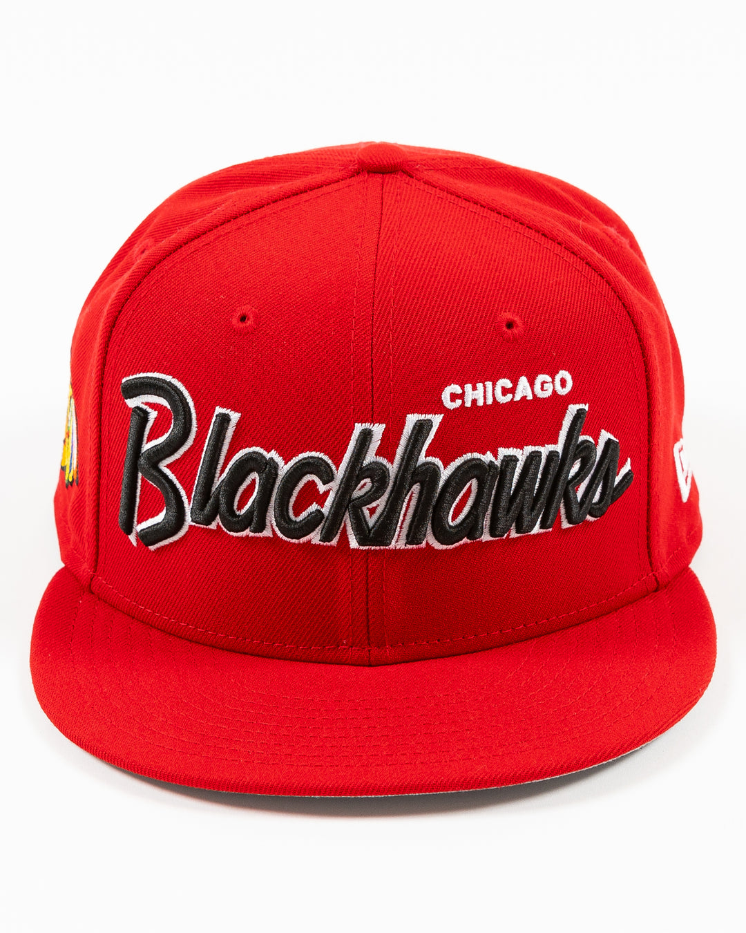 red New Era 9FIFTY snapback cap with Chicago Blackhawks wordmark on front and primary logo on right side - front lay flat