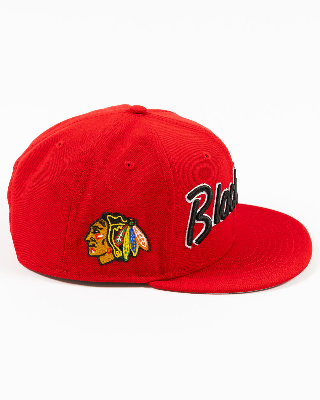 red New Era 9FIFTY snapback cap with Chicago Blackhawks wordmark on front and primary logo on right side - right side lay flat