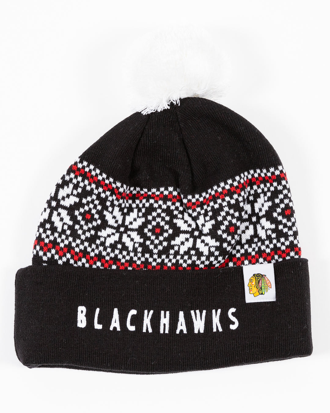 black CCM knit hat with pom with fair isle sweater pattern detail and embroidered Blackhawks wordmark on front cuff - front lay flat