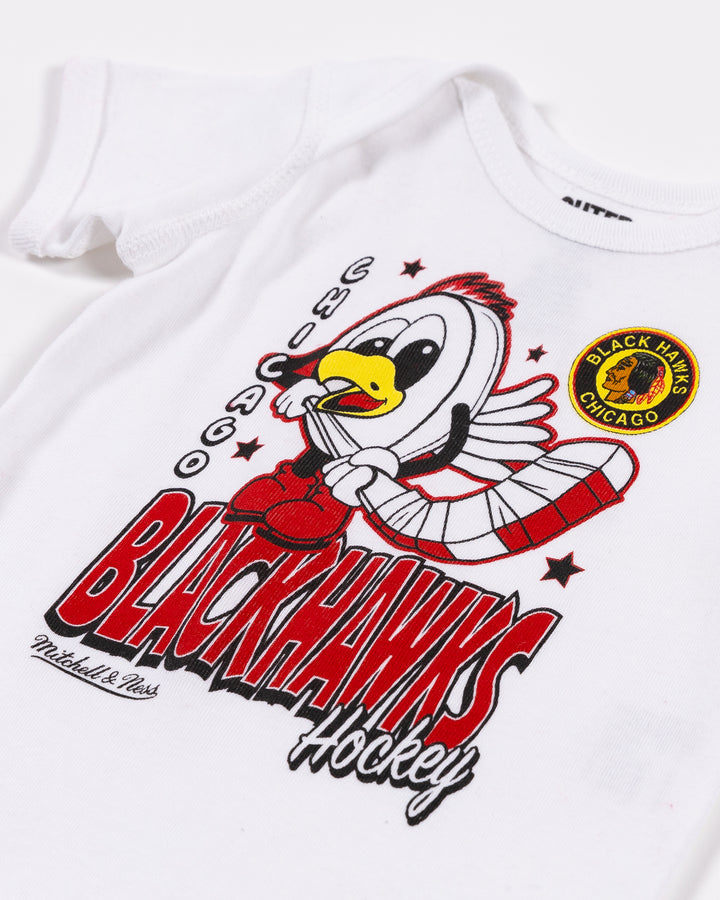 white Mitchell & Ness infant onesie with Chicago Blackhawks Tommy puck graphic across front - detail lay flat