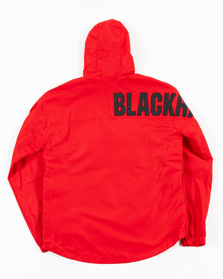 red Colosseum half zip hoodie jacket with Chicago Blackhawks primary logo on left chest and Blackhawks wordmark on shoulder on right arm - back lay flat