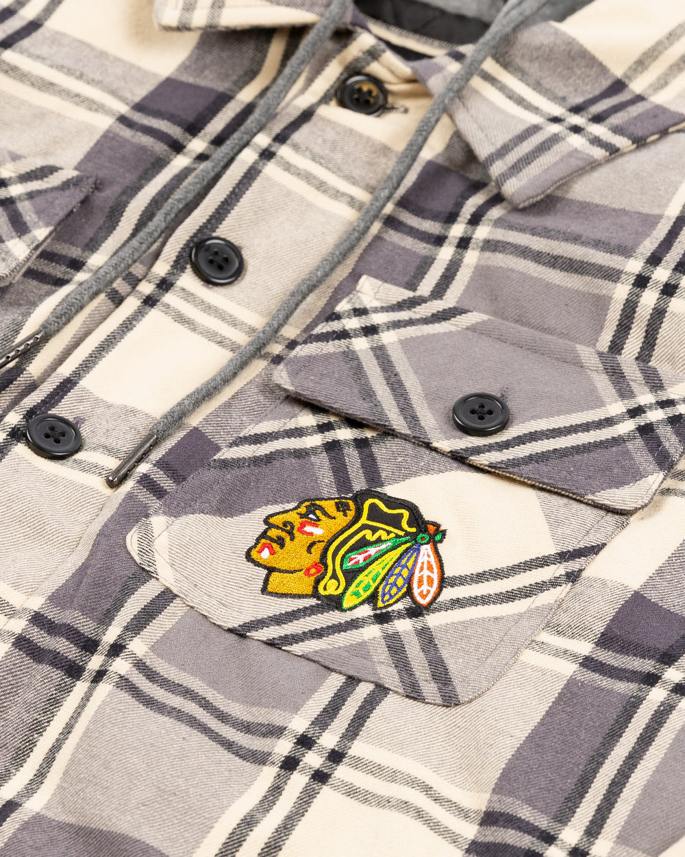 grey plaid Starter hoodie jacket with Chicago Blackhawks primary logo adorning left chest pocket - front detail lay flat