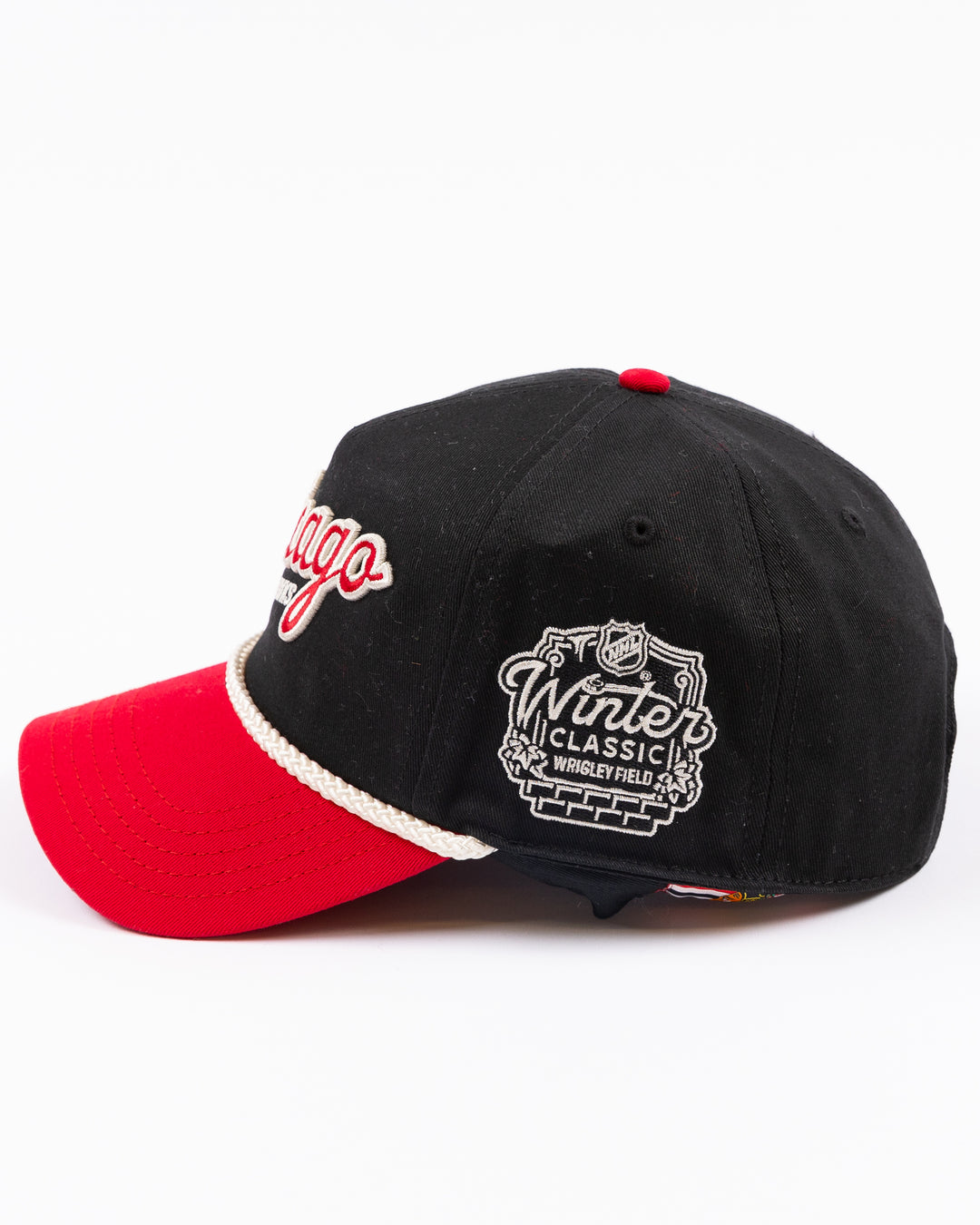 two tone black and red rope American Needle snapback cap with Chicago Blackhawks wodmark embroidered on front and Winter Classic logo embroidered on left side - left side lay flat