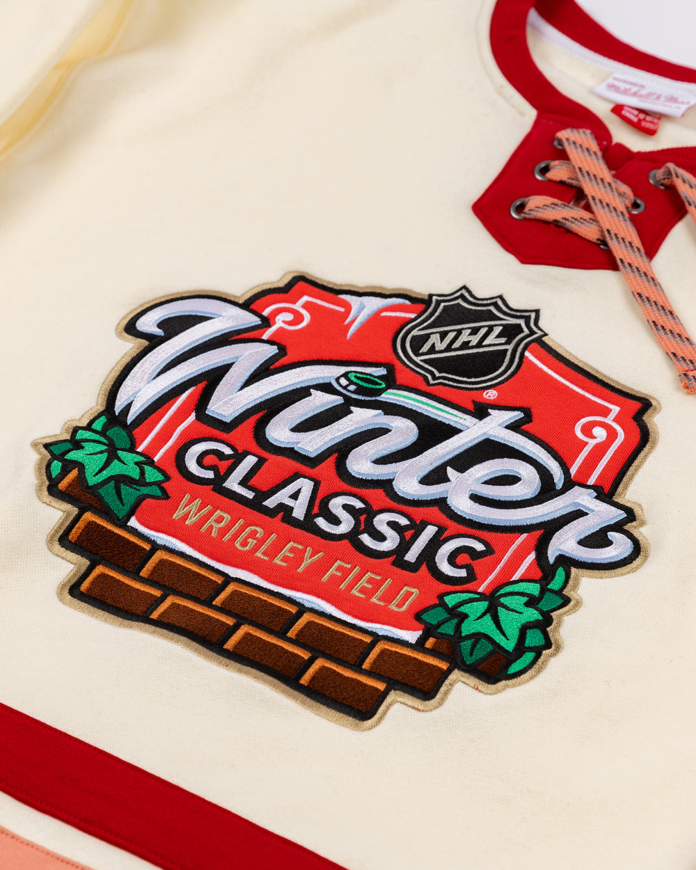 cream Mitchell & Ness crewneck with Chicago Blackhawks Winter Classic NHL logo embroidered on front - front detail lay flat