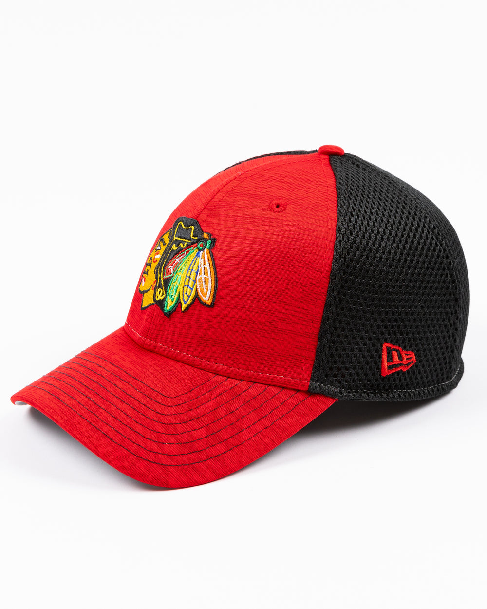 two tone red and black New Era cap with Chicago Blackhawks primary logo embroidered on front - left angle lay flat