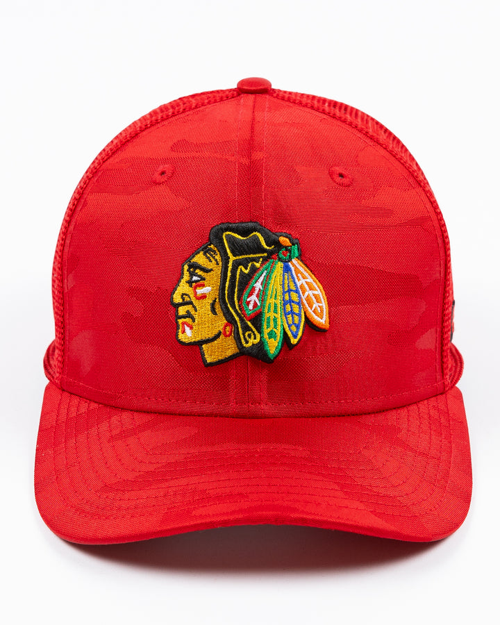 red camo New Era trucker cap with embroidered Chicago Blackhawks primary logo on front - front lay flat