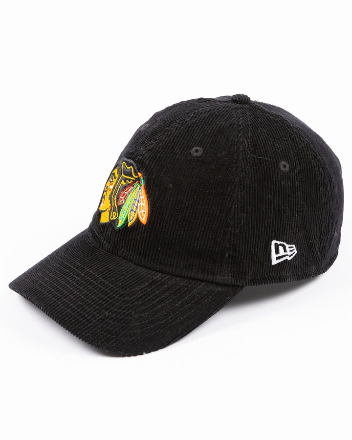 black corduroy New Era adjustable hat with embroidered Chicago Blackhawks primary logo on front - left angle lay flat