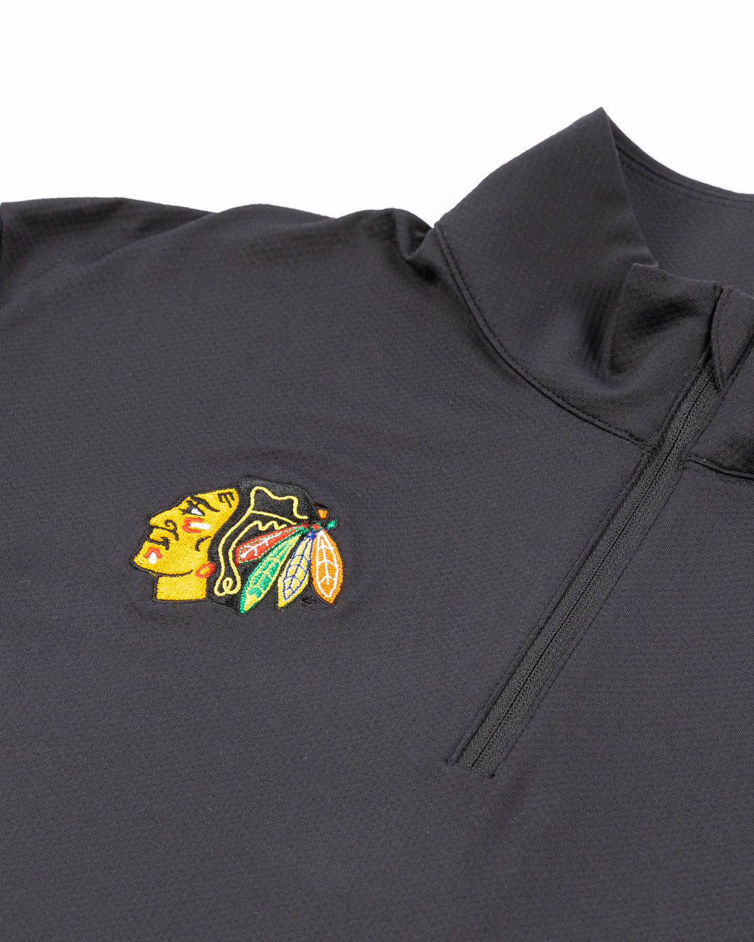 black lululemon half zip golf jacket with Chicago Blackhawks primary logo on right chest - front detail lay flat