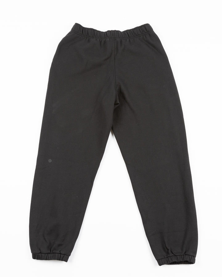 black lululemon women's oversized sweatpants with embroidered Chicago Blackhawks primary logo on left leg - back lay flat