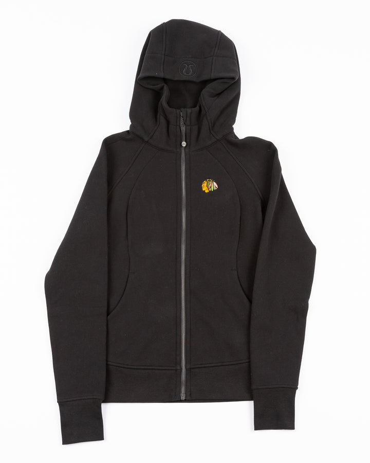 black lululemon scuba full zip women's hoodie with Chicago Blackhawks primary logo embroidered on left chest - front lay flat