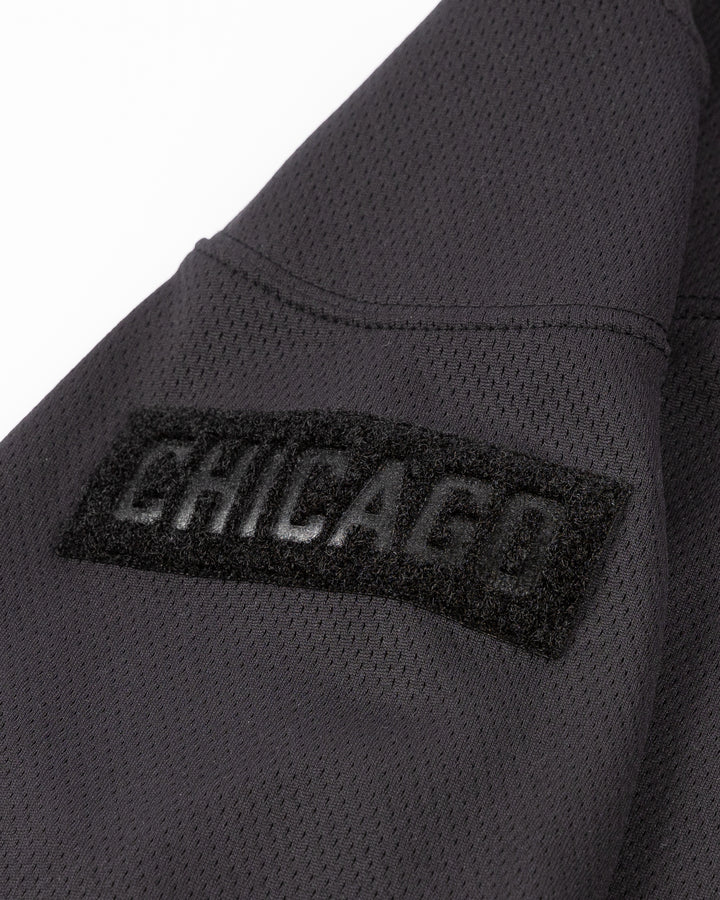 black and brown Fanatics military appreciation practice jersey with Chicago Blackhawks decoration - shoulder detail lay flat