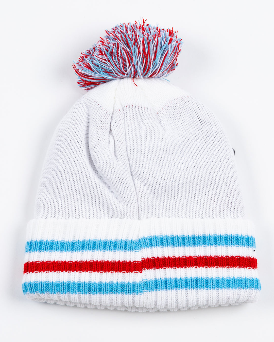 white knit pom hat with Chicago Blackhawks secondary logo on front and primary logo on striped cuff with multi color pom on top in Chicago flag-inspired colorway - back lay flat