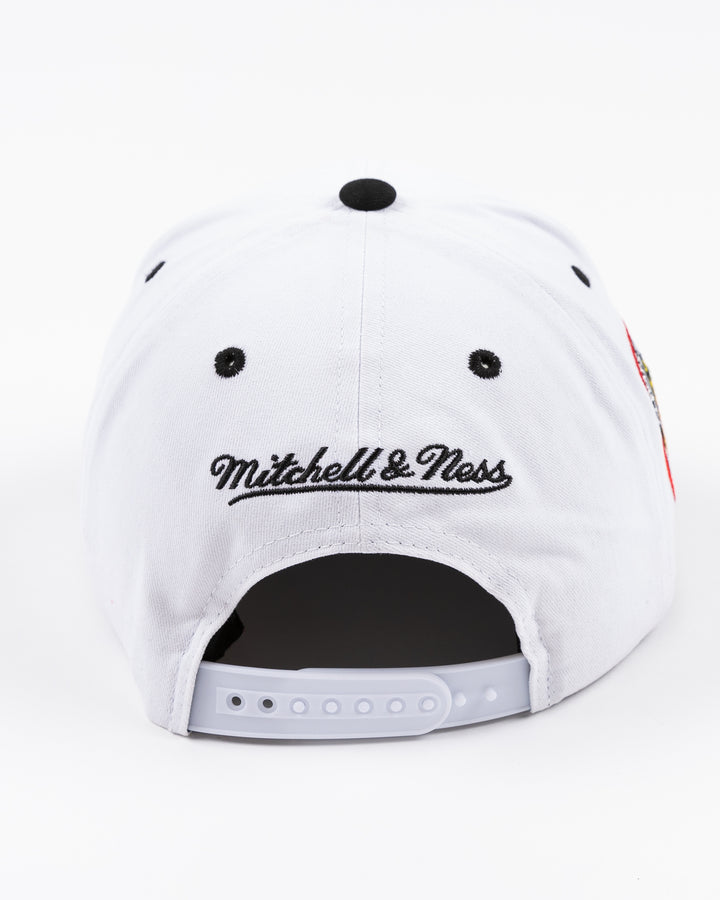 black and white Mitchell & Ness adjustable cap with embroidered Chicago Blackhawks hockey wordmark on front and primary logo on right side - back lay flat