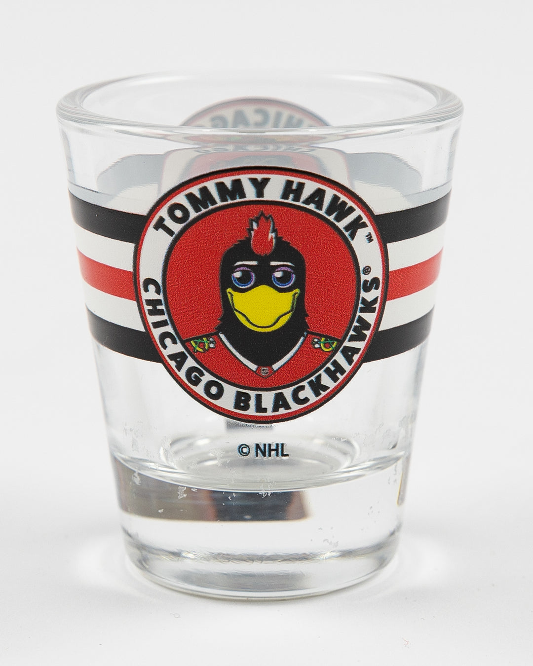 shot glass with Chicago Blackhawks mascot Tommy on classic stripe design - front lay flat