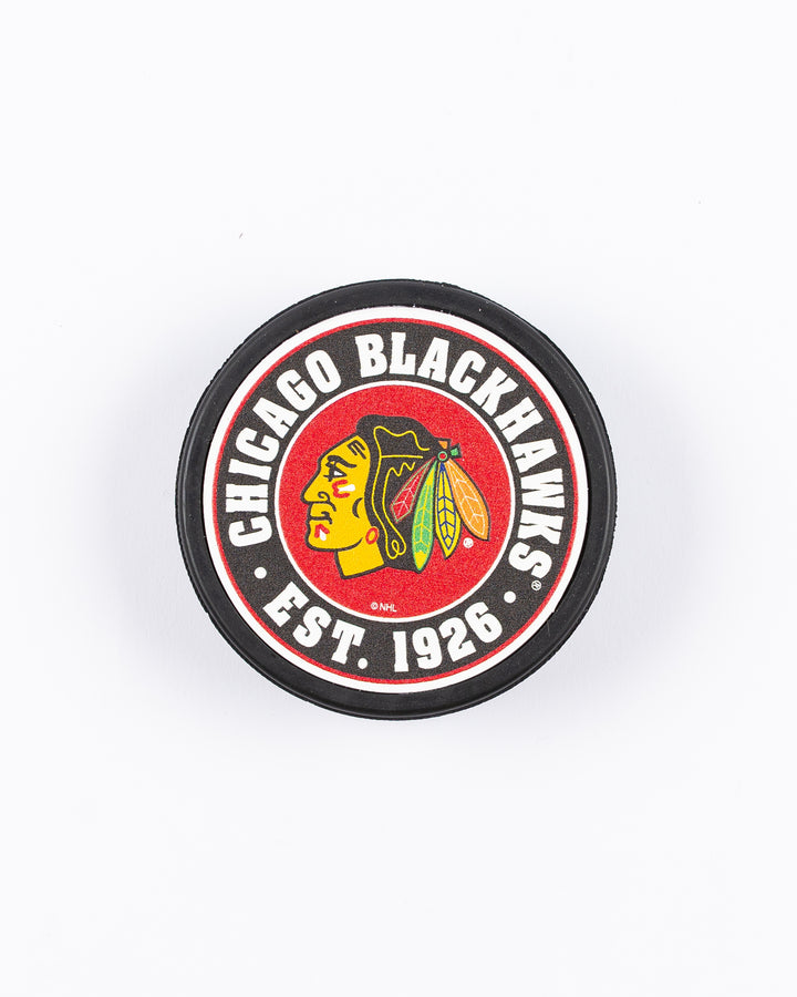 hockey puck with Chicago Blackhawks primary logo and established 1926 word graphic surrounding it - front lay flat
