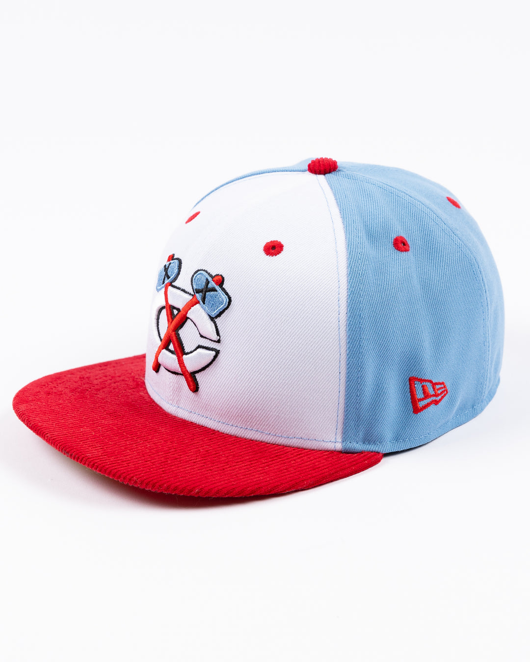 white blue and red New Era fitted 59FIFTY cap with Chicago Blackhawks secondary logo embroidered on front - left angle lay flat