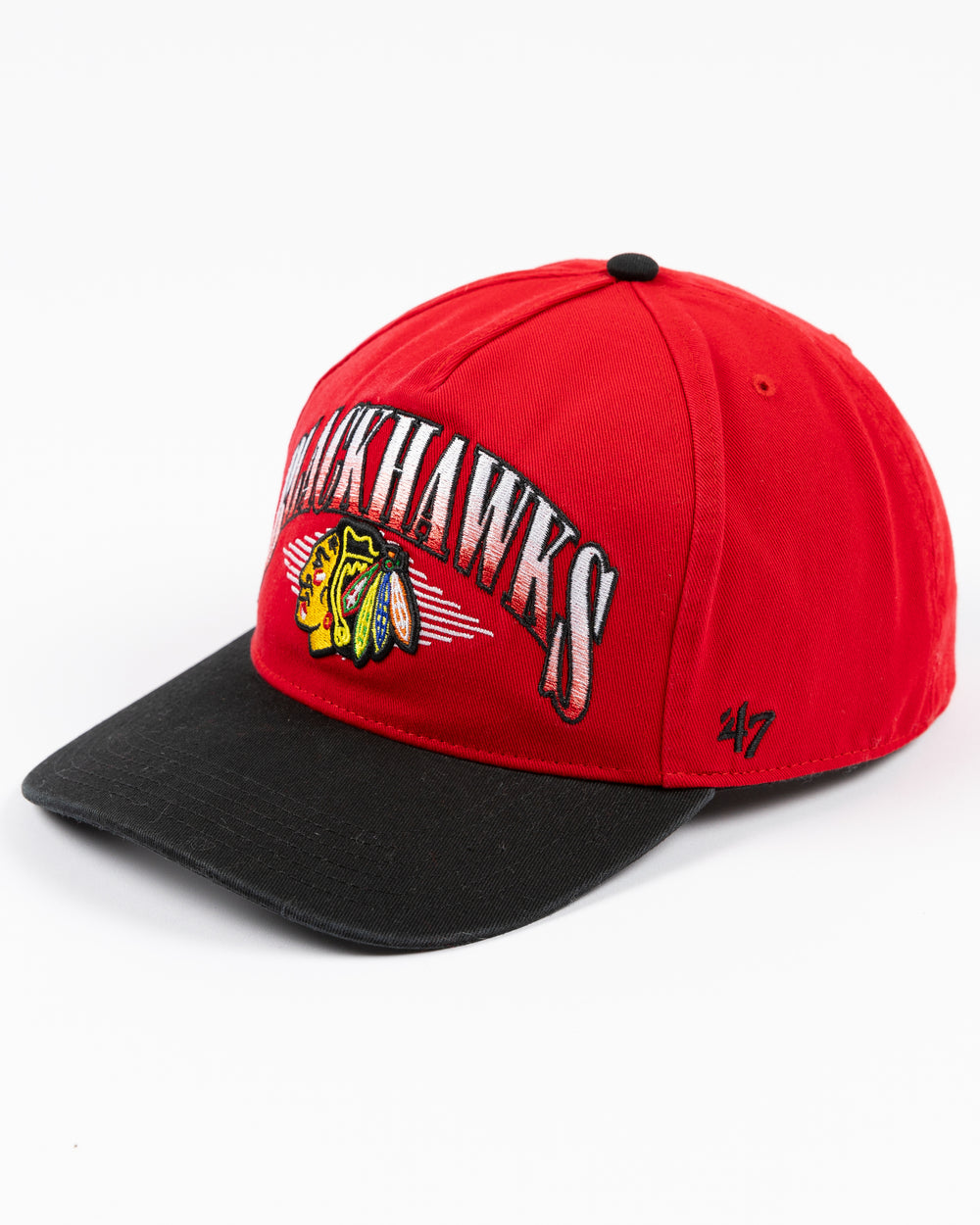 two tone red and black '47 brand adjustable cap with Chicago Blackhawks wordmark and primary logo embroidered on front - left angle lay flat