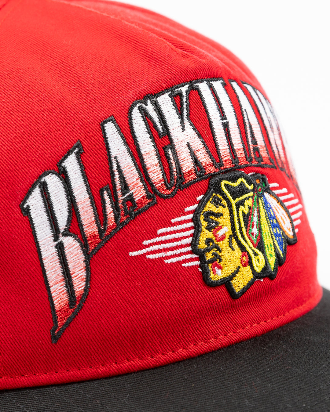 two tone red and black '47 brand adjustable cap with Chicago Blackhawks wordmark and primary logo embroidered on front - front detail lay flat