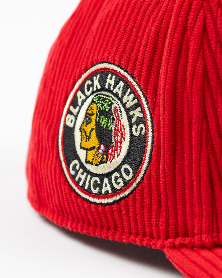 red corduroy '47 brand adjustable hat with embroidered Chicago Blackhawks wordmark on front and vintage logo on right side - side detail lay flat