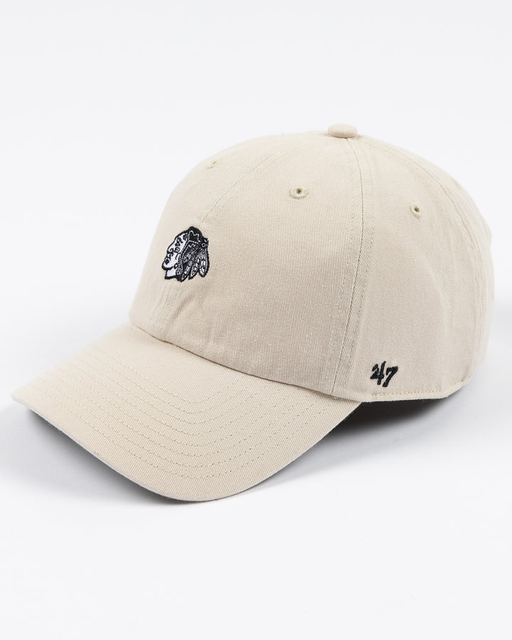 cream '47 brand clean up cap with mini tonal Chicago Blackhawks primary logo embroidered on front - left angle lay flat