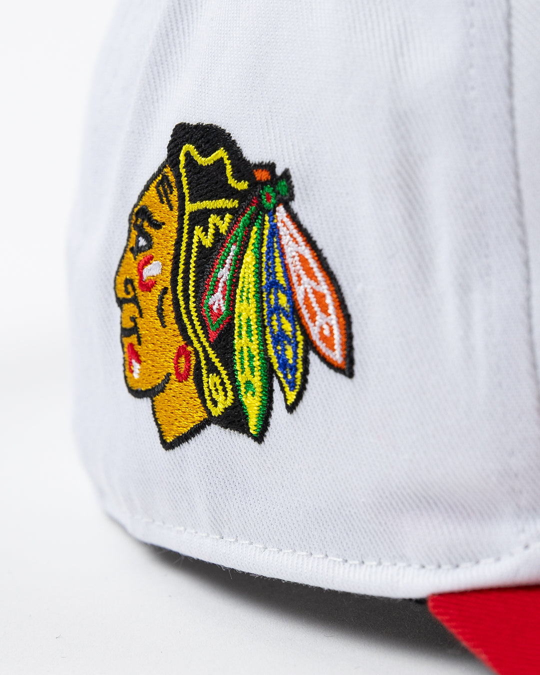 white and red adjustable '47 brand hat with Chicago Blackhawks wordmark embroidered on front and primary logo on right side - side detail lay flat