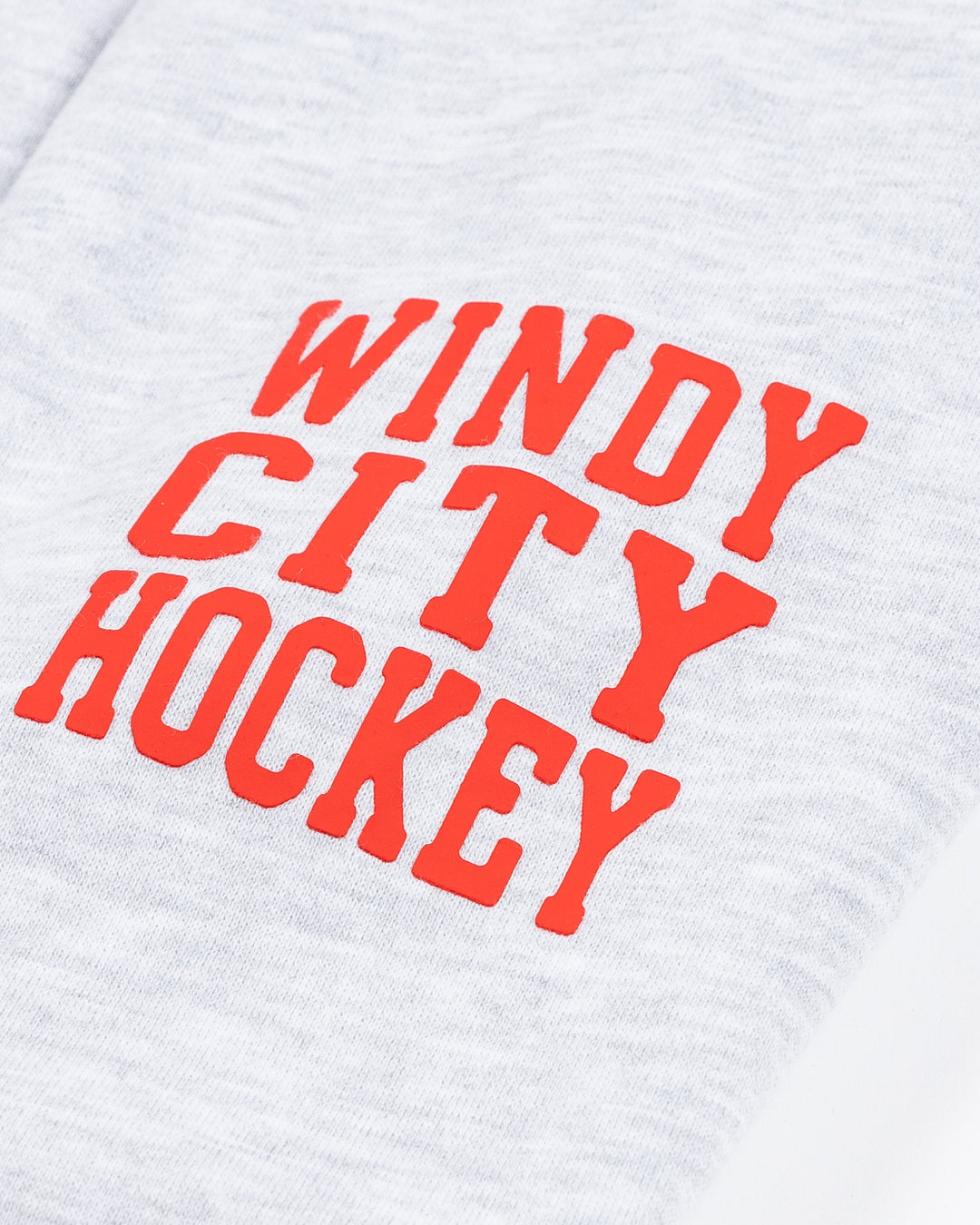 light grey women's '47 brand cropped hoodie with Chicago Blackhawks secondary logo on shoulder and wordmark and wrist with Hawks wordmark and primary logo on front - cuff detail lay flat