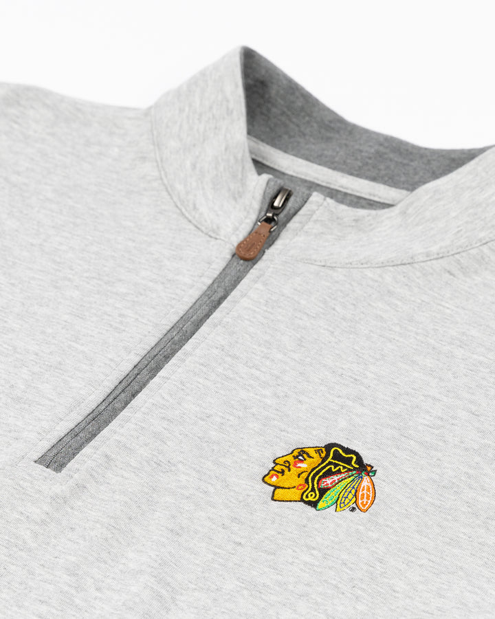 grey johnnie-o quarter zip with Chicago Blackhawks primary logo embroidered on left chest - front detail lay flat