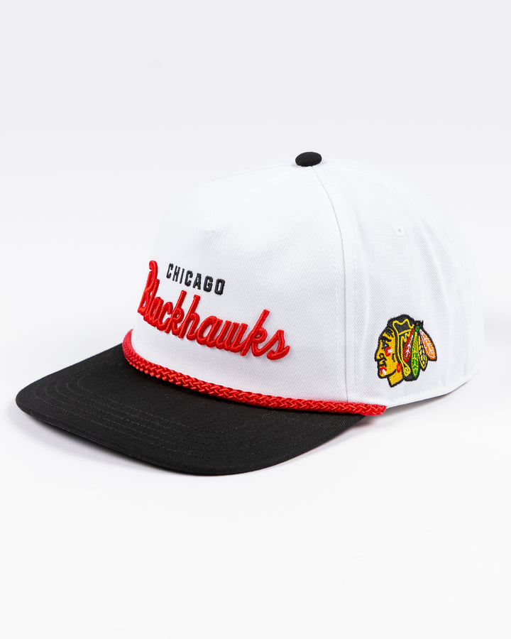 American Needle white rope snapback hat with Chicago Blackhawks wordmark on the front and primary logo on left side - left angle lay flat