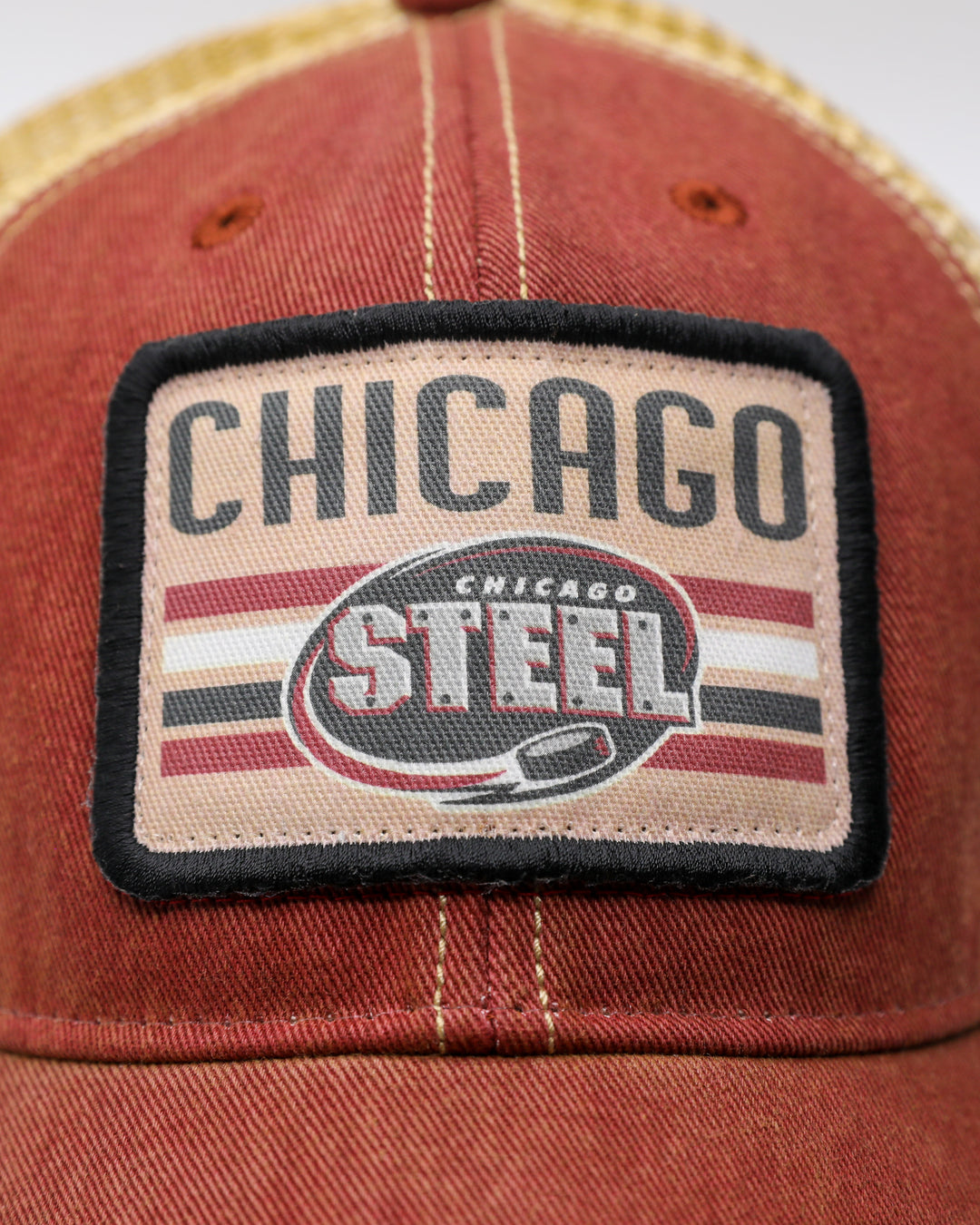 rust and tan adjustable trucker cap with Chicago Steel patch on front - front detail lay flat