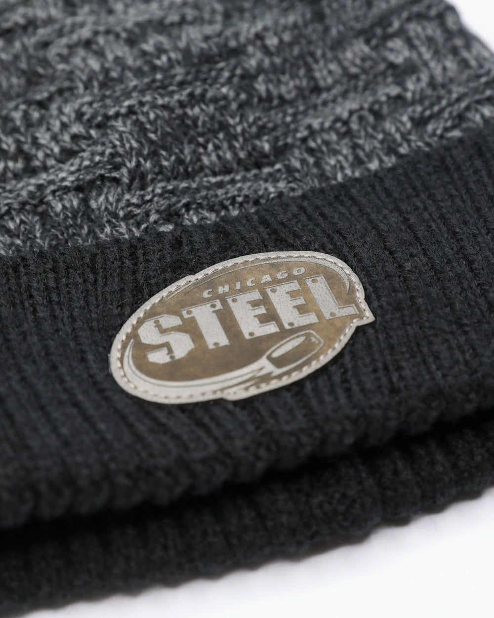 two-tone dark grey and black knit beanie with embroidered Chicago Steel logo on front cuff - front detail lay flat