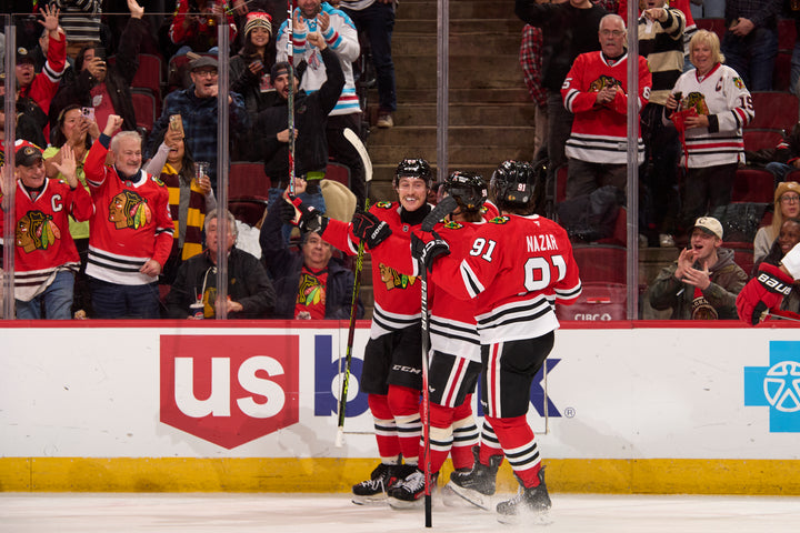 Chicago Blackhawks players Bertuzzi, Bedard and Nazar celebrating goal scored by Bertuzzi against the Carolina Hurricanes on January 20, 2025