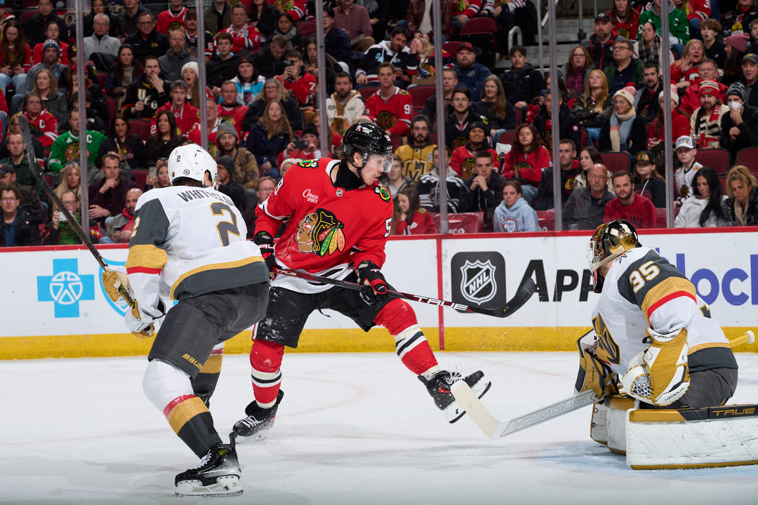 Chicago Blackhawks player Tyler Bertuzzi scoring against the Vegas Golden Knights on January 18, 2025