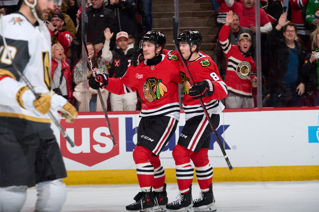 Chicago Blackhawks players Tyler Bertuzzi and Ryan Donato celebrating Bertuzzi score against the Vegas Golden Knights on January 18, 2025