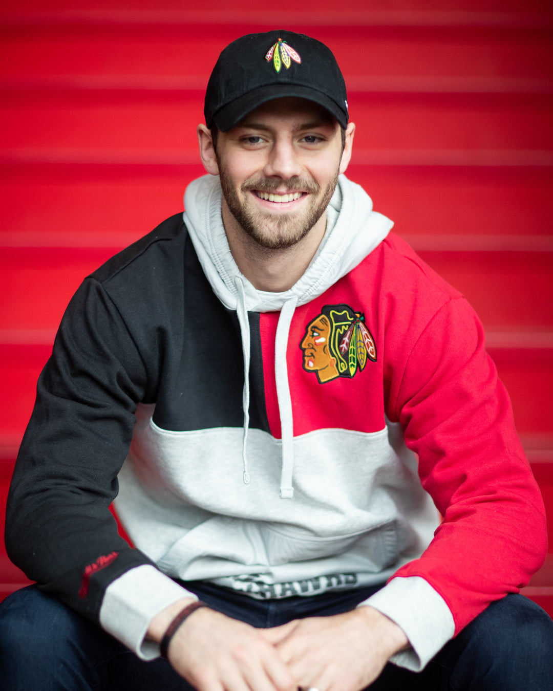 '47 brand black adjustable hat with embroidered four feathers logo on front - on Jason Dickinson