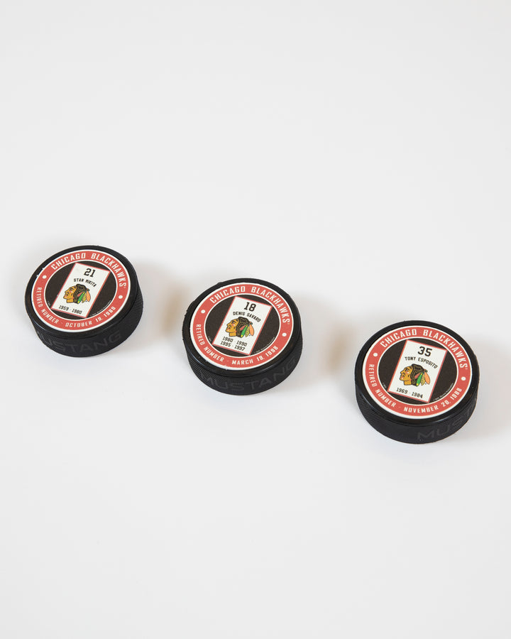 Mustang Stan Mikita retirement banner series red and black background puck - collection shot