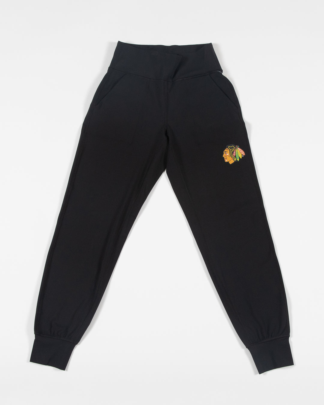 black lululemon women's jogger with full color Chicago Blackhawks primary logo on left leg - front lay flat